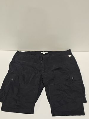 the shorts are black and have buttons on the side