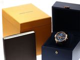 a box with a watch inside of it and a box with a watch inside of it