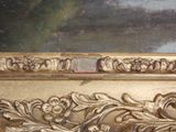 a picture of a gold frame with a painting in the background