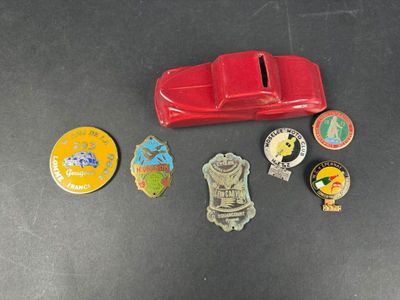 a lot of pins and badges on a table