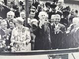 black and white photograph of a crowd of people standing on a boat