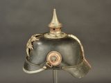 a helmet with a dragon on it on a stand