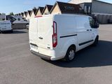 a white van that is parked in a parking lot