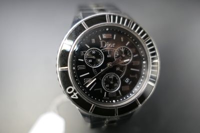 a close up of a watch on a table