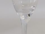 underside view of a wine glass with a crack in the bottom