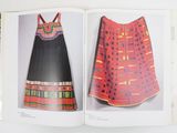 an open book with a picture of a dress and a picture of a woman ' s dress