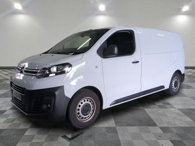 a picture of a white van on a checkered floor
