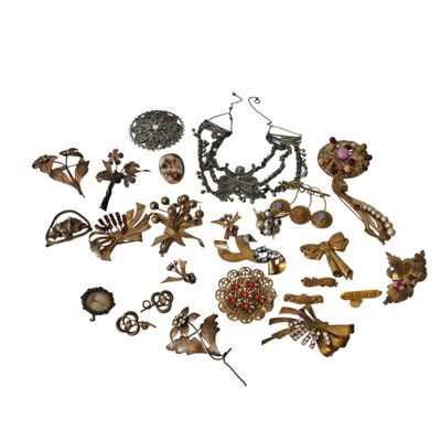 a bunch of different types of jewelry on a white surface