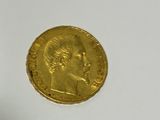 an image of a gold coin on a white surface