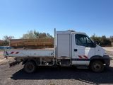 a white truck that is parked in the dirt