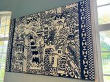 a large painting hanging on the wall in a room