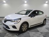 a white car parked in a room with a checkered floor
