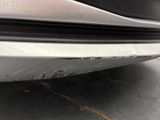 a close up of a car ' s bumper with a lot of dirt on it