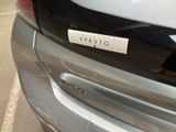 a close up of a car with a sticker on the back of it