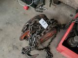 a red box with chains and tools on the floor