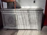 a cabinet that is sitting in the middle of a room
