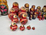 a lot of colorful russian nesting dolls on the table