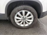 a close up of a tire on a car ' s rim