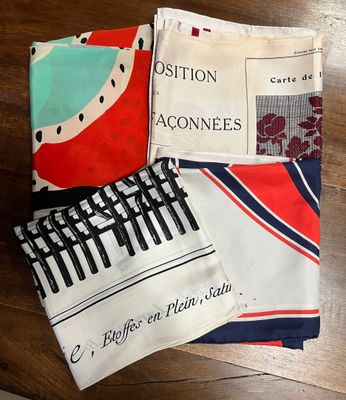 three different types of cloths on a table with a book