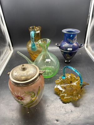many glass vases sitting on a shelf in a room