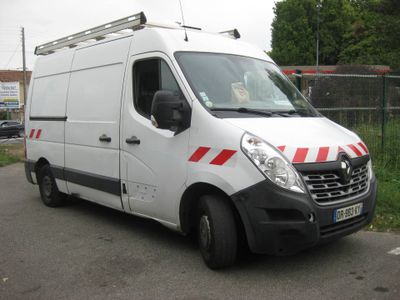 a white van with red stripes parked in a parking lot