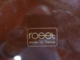 a close up of a glass with a logo on it