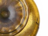 a close up of a glass vase with a gold base