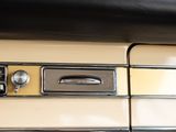 a close up of a car dashboard with a clock on it