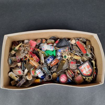 a cardboard box filled with assorted keys on a table