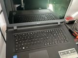 a laptop computer that is sitting on a desk