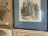 four framed pictures on the wall of a room