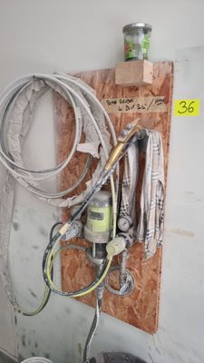 a picture of a kitchen with a sink and a hose