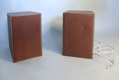 two speakers sitting next to each other on a table