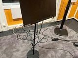 a flat screen tv sitting on a stand in a room