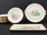 many plates and a tray with a picture on them
