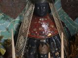 a statue of a woman with a crown in a bowl