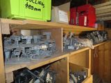 many different types of electrical equipment on the shelves