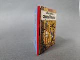 a red and blue book sitting on a table