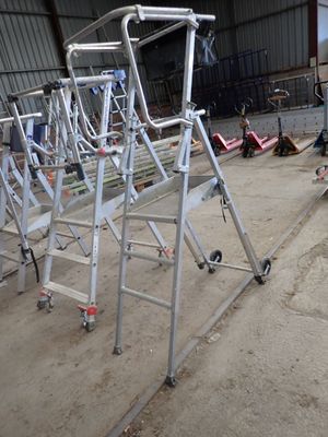 a metal ladder that is sitting in the middle of a building