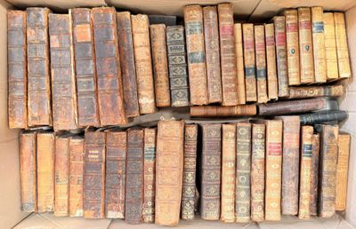 a box full of old books sitting on the floor