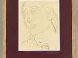drawing of a woman ' s face in a wooden frame on a wall