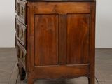 an antique wooden chest of drawers on wheels on a wooden floor