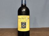 a bottle of wine that is sitting on a table