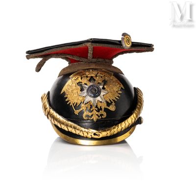 a black and gold helmet with a gold eagle on it