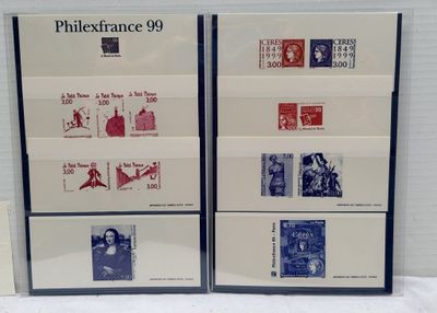 two framed photographs of various postages on display on a table