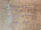 a piece of wood that has writing on it