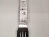 a fork hanging on the wall with a piece of paper attached to it