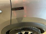 a close up of a car ' s wheel with a sticker on it