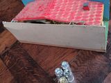 a cardboard box with a fish inside of it on a table