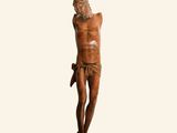 an image of a wooden statue of a man on a cross